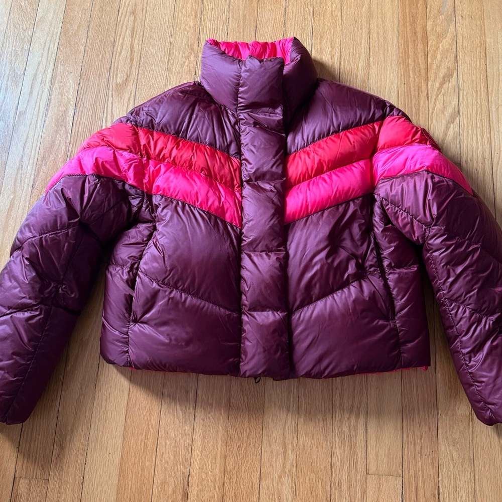 Brand new Medium Sangria Multi/ Pink Canada Goose coat. The coat is reversible.